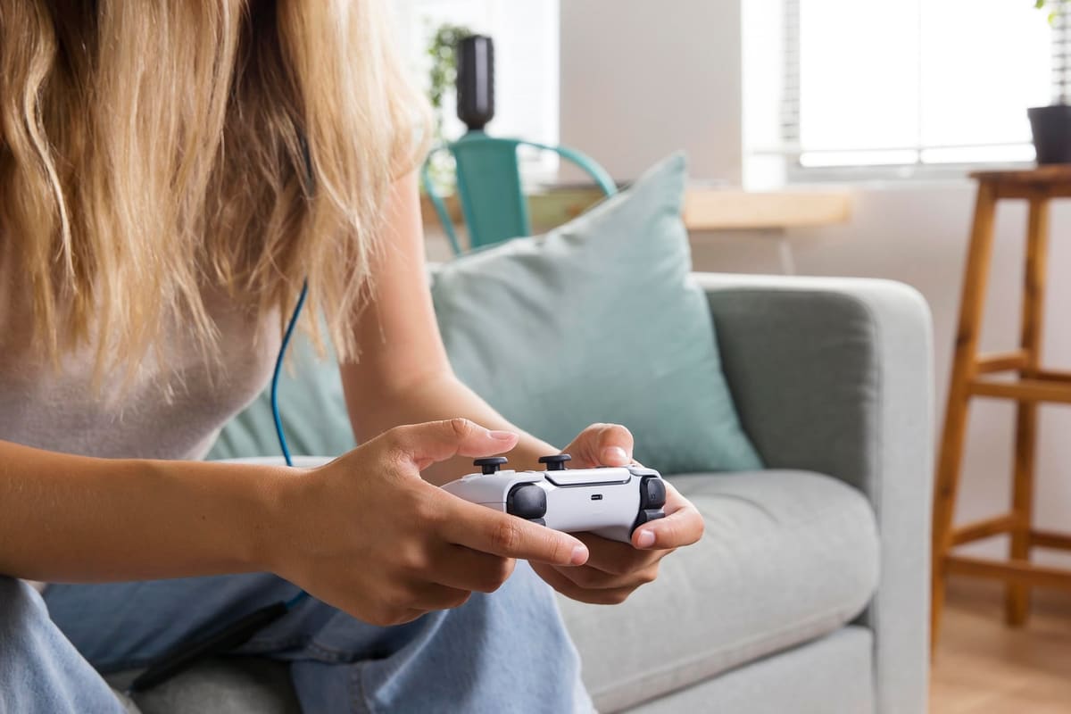 Close-up of hands holding a game controller